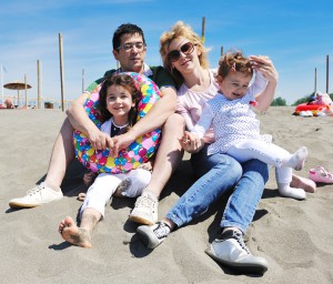 happy young family have fun on beach